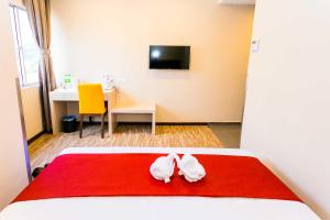 Postel nebo postele na pokoji v ubytování Icon Hotel Segamat
