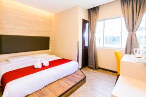 Postel nebo postele na pokoji v ubytování Icon Hotel Segamat