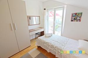 Posteľ alebo postele v izbe v ubytovaní Apartments Šuperba