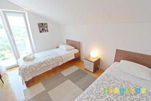 Posteľ alebo postele v izbe v ubytovaní Apartments Šuperba