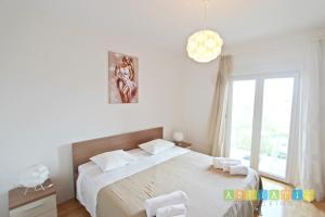 Posteľ alebo postele v izbe v ubytovaní Apartments Šuperba