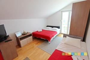 Posteľ alebo postele v izbe v ubytovaní Apartments Šuperba