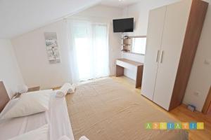 Posteľ alebo postele v izbe v ubytovaní Apartments Šuperba