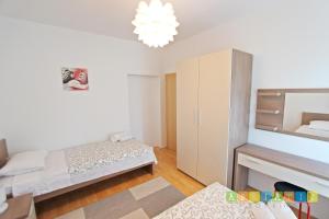 Posteľ alebo postele v izbe v ubytovaní Apartments Šuperba