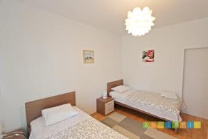 Posteľ alebo postele v izbe v ubytovaní Apartments Šuperba