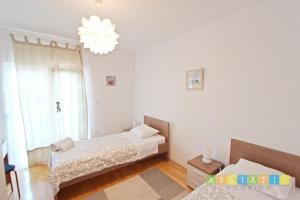 Posteľ alebo postele v izbe v ubytovaní Apartments Šuperba