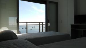 Ένα ή περισσότερα κρεβάτια σε δωμάτιο στο Hotel Ribera