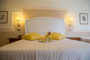Voodi või voodid majutusasutuse Parco del Lago Resort & SPA toas