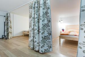 a room with a blue and white curtain at Apartment Wanda in Krakow