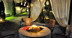 a table with a candle on top of a patio at Anatoli Apartments Polichrono in Polychrono