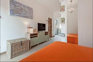 Ένα ή περισσότερα κρεβάτια σε δωμάτιο στο L'Attichetto di Ponte Milvio