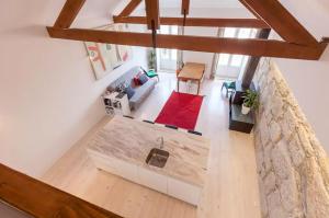 an overhead view of a living room in a loft at Boutique Rentals - Hidden Treasure in Porto