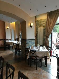 Restavracija oz. druge možnosti za prehrano v nastanitvi Casa Iris-Hotel & Restaurant