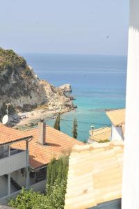 a view of the ocean from a building at Hotel Agios Nikitas in Agios Nikitas