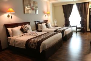 Postel nebo postele na pokoji v ubytování Pars International Hotel