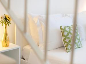 Postel nebo postele na pokoji v ubytování B&B Lamie Di Olimpia