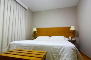 Postel nebo postele na pokoji v ubytování Hotel Jucamar
