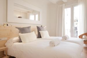 Ένα ή περισσότερα κρεβάτια σε δωμάτιο στο Canela Homes BARCELONA MACBA