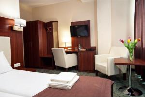 Posteľ alebo postele v izbe v ubytovaní Hotel Młyn