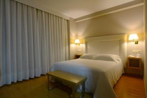 Postel nebo postele na pokoji v ubytování Hotel Jucamar