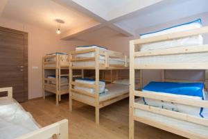 Ένα ή περισσότερα κρεβάτια σε δωμάτιο στο House Apartments Jahorinko +87 φωτογραφίες