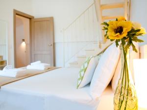 Postel nebo postele na pokoji v ubytování B&B Lamie Di Olimpia