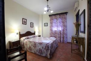 Ein Bett oder Betten in einem Zimmer der Unterkunft Hostal Rocio