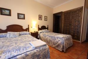 Ein Bett oder Betten in einem Zimmer der Unterkunft Hostal Rocio