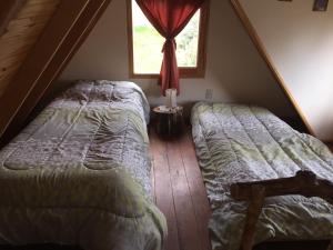 
Una cama o camas en una habitación de Cabañas del Michay
