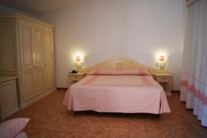 Postel nebo postele na pokoji v ubytování Hotel Montiruju