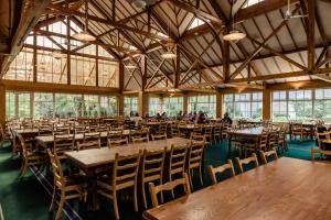 a large room with wooden tables and chairs at DCU Rooms All Hallows in Dublin