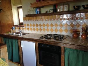 Kuchyňa alebo kuchynka v ubytovaní Maison Angèle