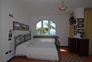 Кровать или кровати в номере Bella Baia Relais