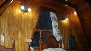 Cama ou camas em um quarto em Cabañas Bosque Del Faldeo