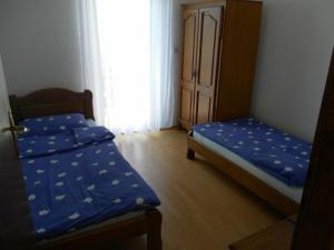 Posteľ alebo postele v izbe v ubytovaní Apartments Stojanović