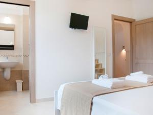 Postel nebo postele na pokoji v ubytování B&B Lamie Di Olimpia