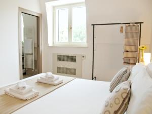 Postel nebo postele na pokoji v ubytování B&B Lamie Di Olimpia