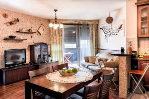 a kitchen and living room with a table and chairs at My Budapest Apartment in Budapest