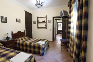 Ein Bett oder Betten in einem Zimmer der Unterkunft Hostal Rocio