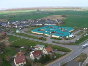 an aerial view of a town with houses and a road at Hotel An der Hasenheide in Bentwisch