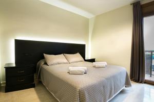 Posteľ alebo postele v izbe v ubytovaní Hotel Montmar