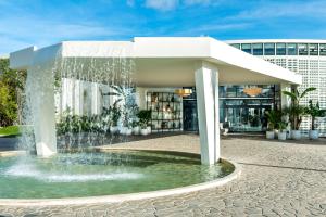 a fountain in front of a building at Ocean Riviera Paradise All Inclusive in Playa del Carmen