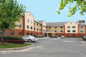 a parking lot in front of a building at Extended Stay America Select Suites - Hartford - Manchester in Manchester