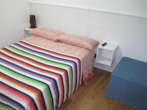 Postel nebo postele na pokoji v ubytování Santos B&B