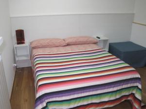Postel nebo postele na pokoji v ubytování Santos B&B