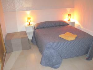 Postel nebo postele na pokoji v ubytování Santos B&B