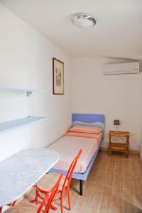 Postel nebo postele na pokoji v ubytování Santos B&B