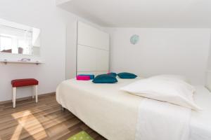 Postel nebo postele na pokoji v ubytování Apartmani Island