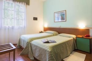 Postel nebo postele na pokoji v ubytování Albergo Ristorante San Matteo
