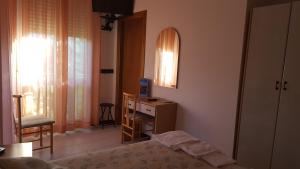 Postel nebo postele na pokoji v ubytování Hotel Patrizia